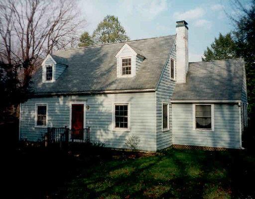574 Ridgebury Road Ridgefield, CT 06877 - Photo 1 of 1 a front view of a house with yard