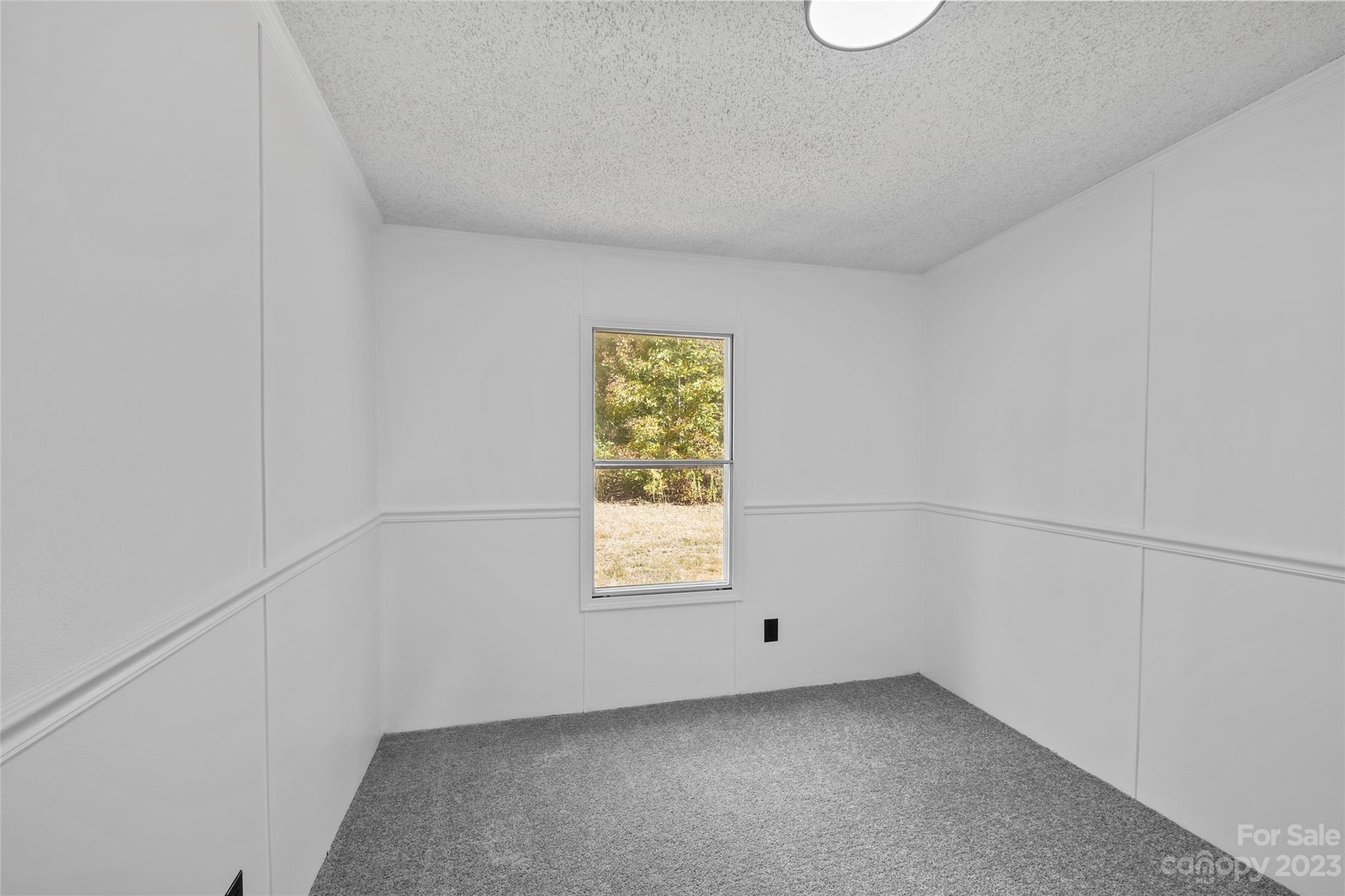 11341 Flowes Store Road Midland, NC 28107 - Photo 13 of 23 a view of an empty room with a window