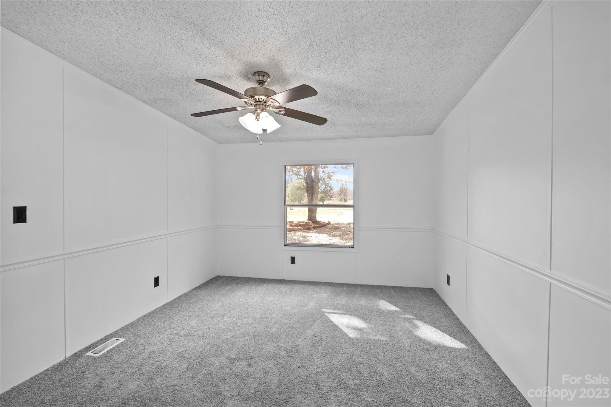 11341 Flowes Store Road Midland, NC 28107 - Photo 18 of 23 wooden floor in an empty room with a window