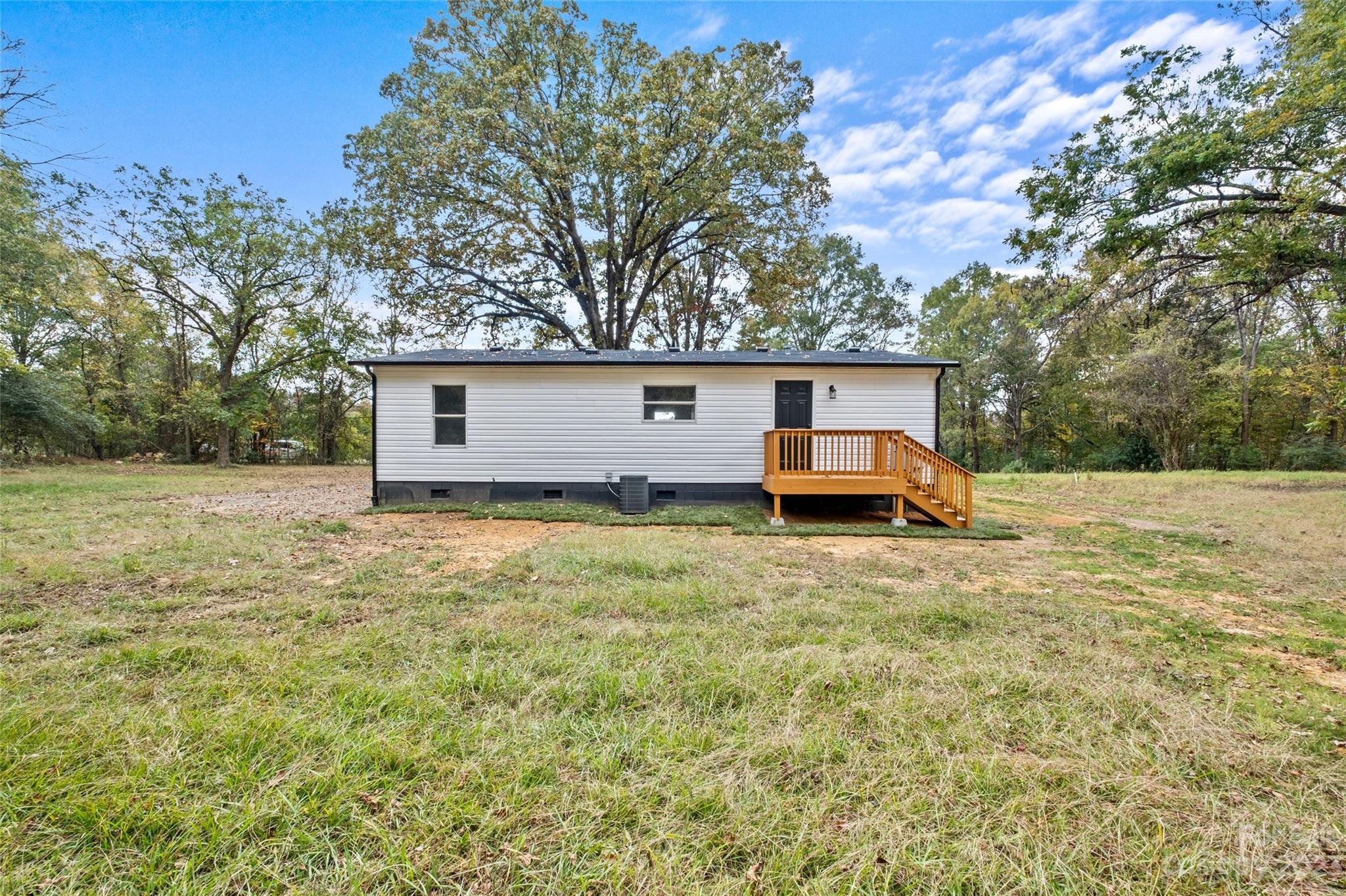 11341 Flowes Store Road Midland, NC 28107 - Photo 22 of 23 a house view with a garden space
