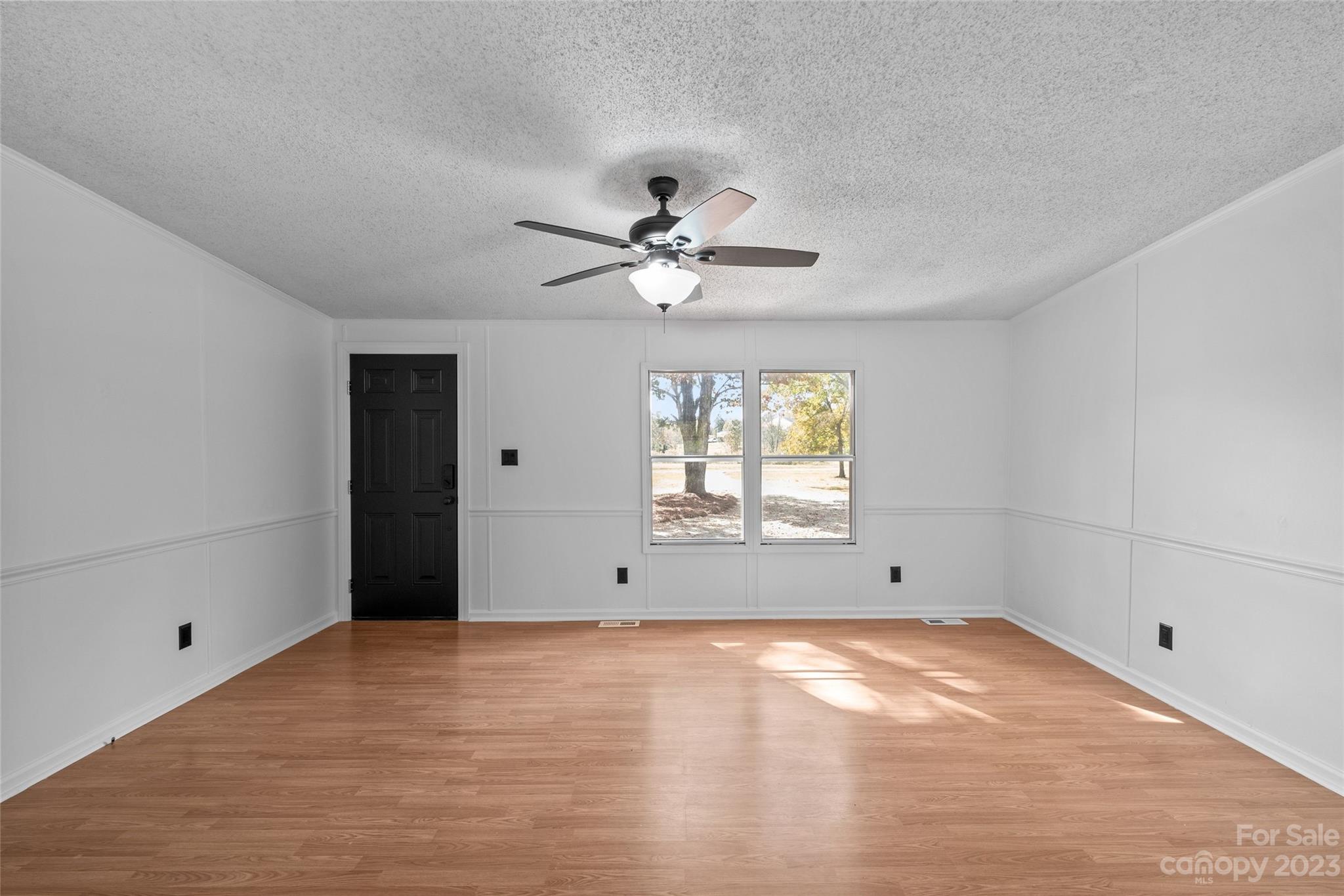 11341 Flowes Store Road Midland, NC 28107 - Photo 5 of 23 wooden floor in an empty room with a window