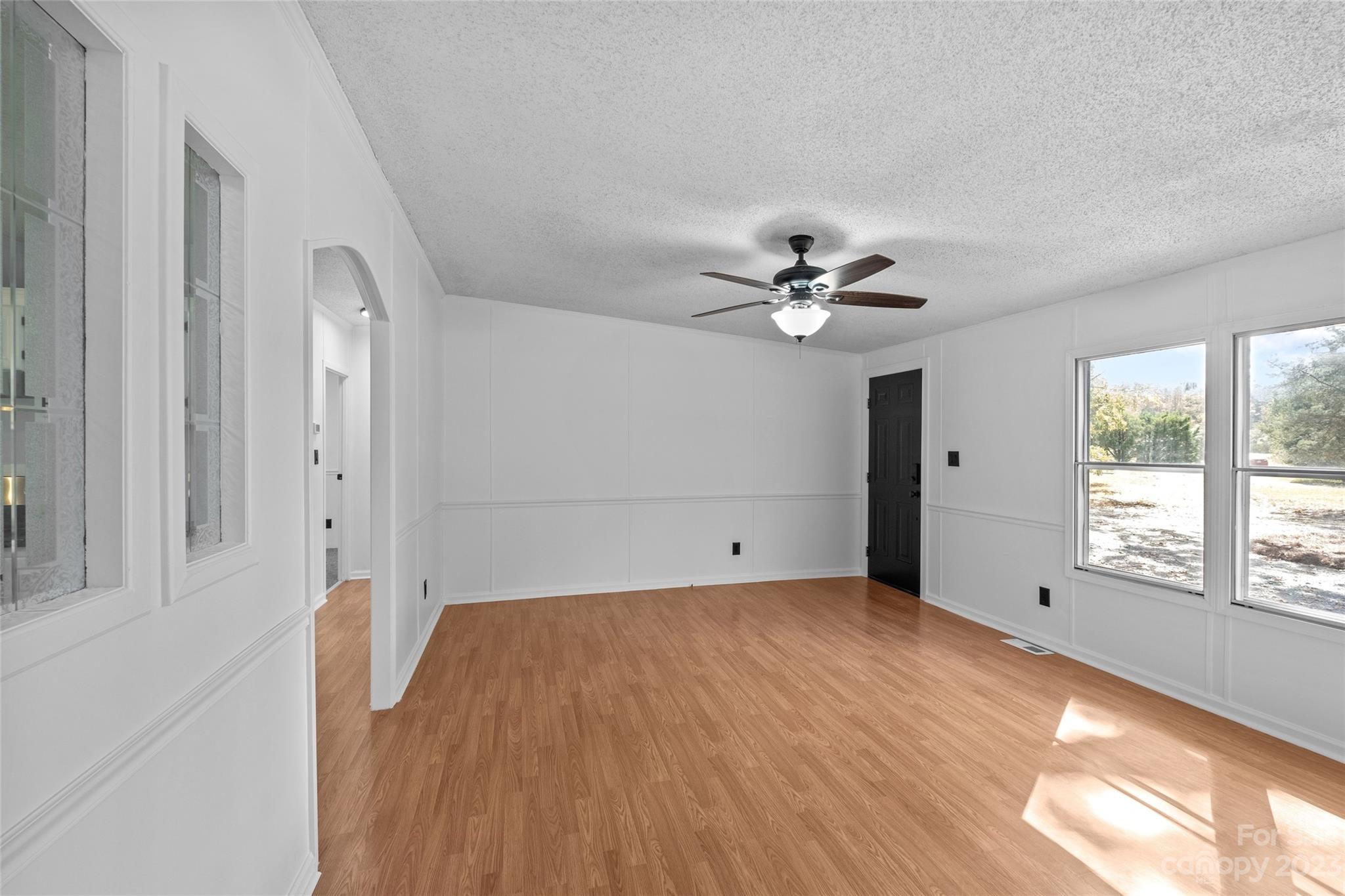 11341 Flowes Store Road Midland, NC 28107 - Photo 7 of 23 a view of a livingroom with a ceiling fan and window