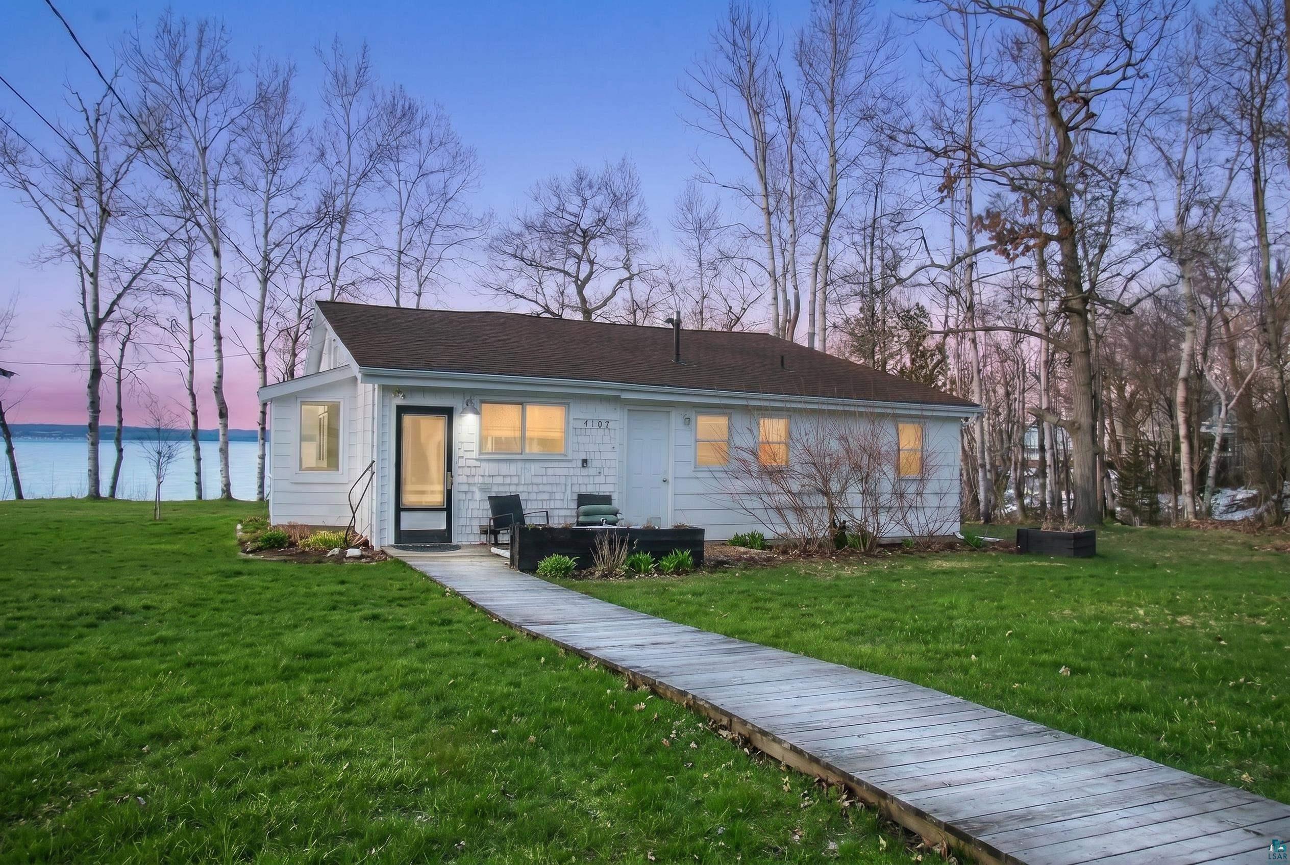 View of front facade with a lawn
