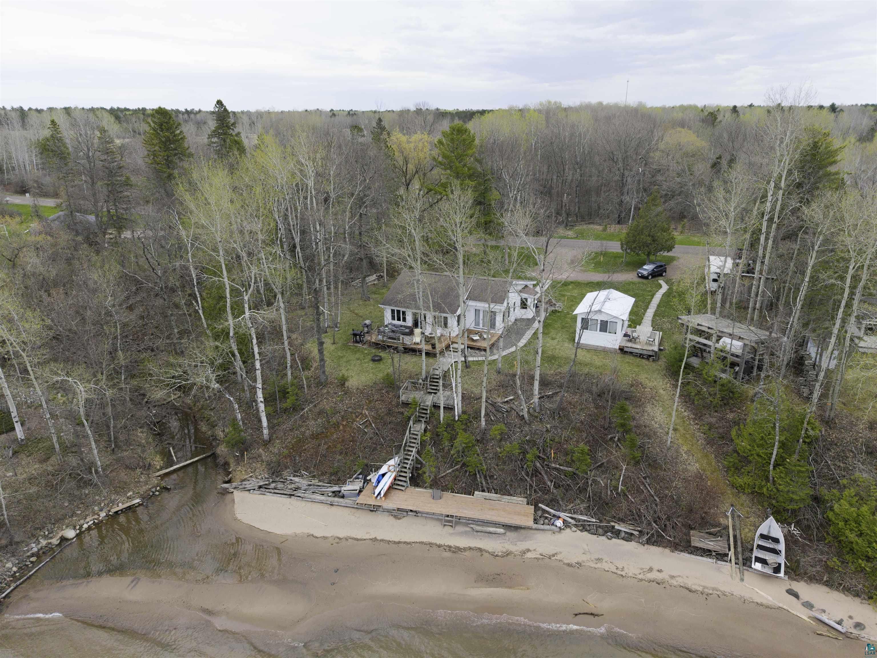 4107 B Lake Park Road Ashland, WI 54806 - Photo 23 of 23 Waterfront property featuring a sandy beach, private dock, and a multi-level deck