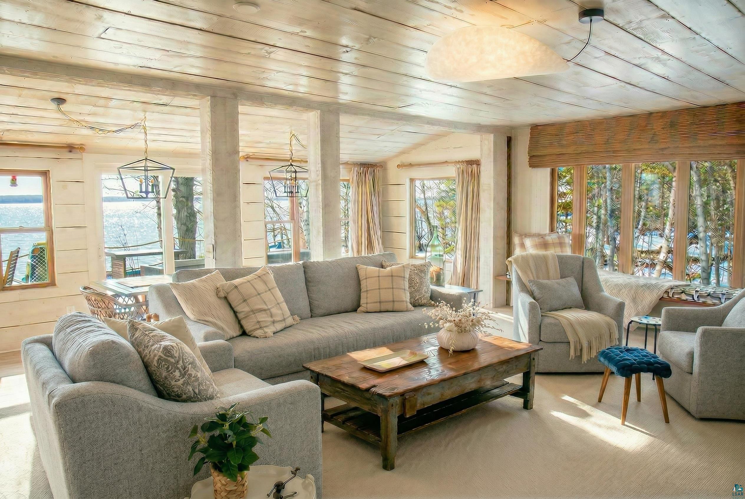 4107 B Lake Park Road Ashland, WI 54806 - Photo 4 of 15 Carpeted living area featuring a vaulted wooden ceiling and wooden walls