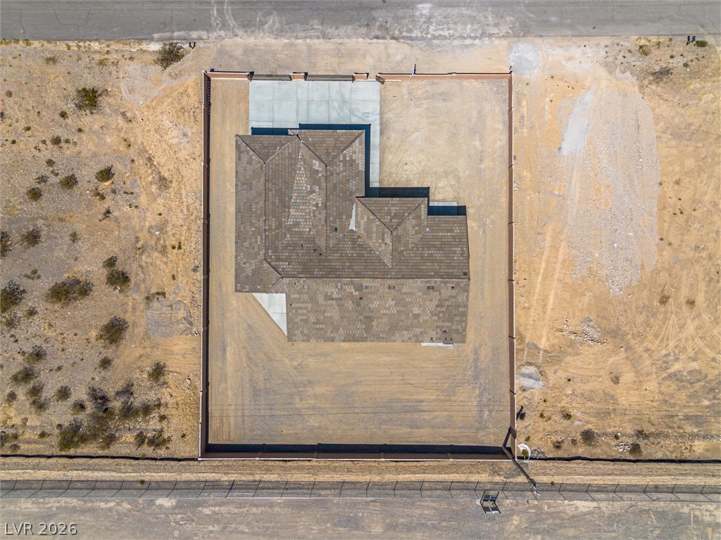 1061 Factory Road Pahrump, NV 89048 - Photo 41 of 41 An aerial perspective reveals a new construction home nestled on a spacious lot, with ample room for future landscaping.
