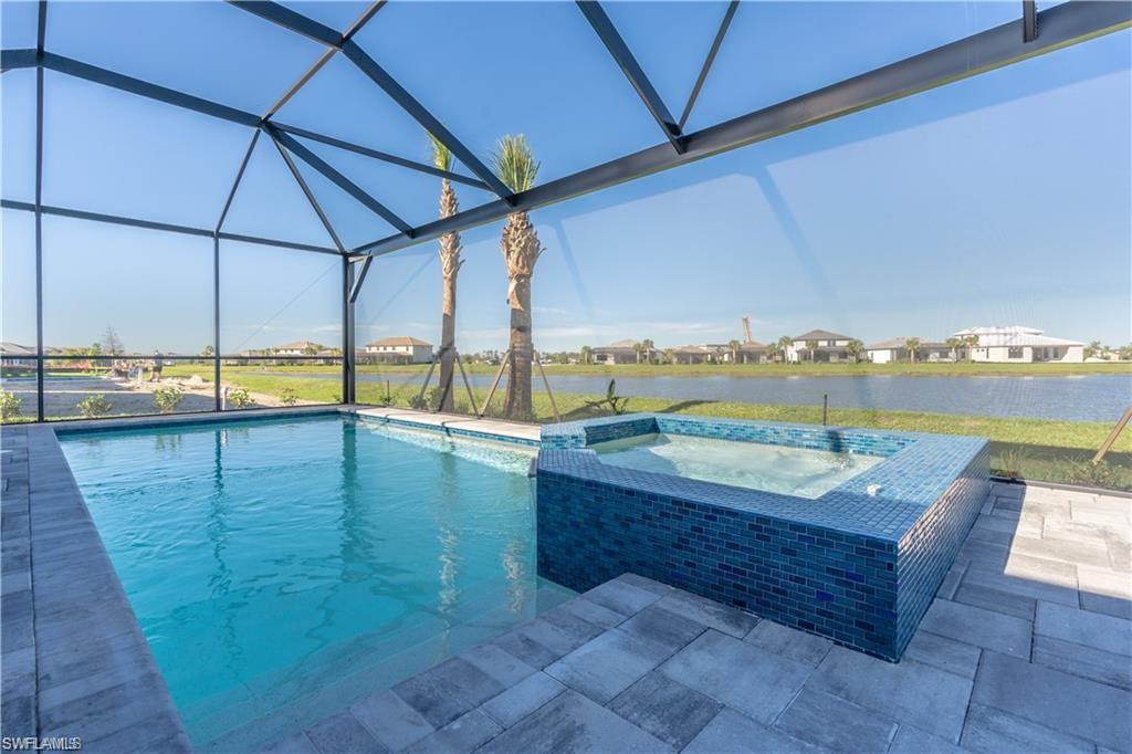 a view of a swimming pool with a lounge chair