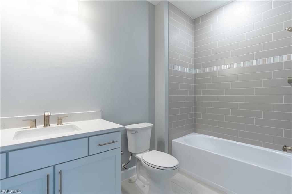 20207 Napa Loop Estero, FL 33928 - Photo 20 of 42 a bathroom with a sink toilet and bathtub