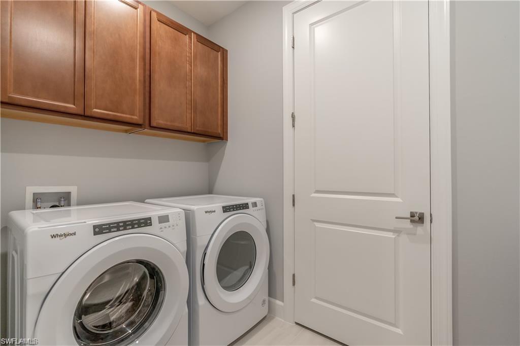 20207 Napa Loop Estero, FL 33928 - Photo 22 of 42 a utility room with dryer and washer