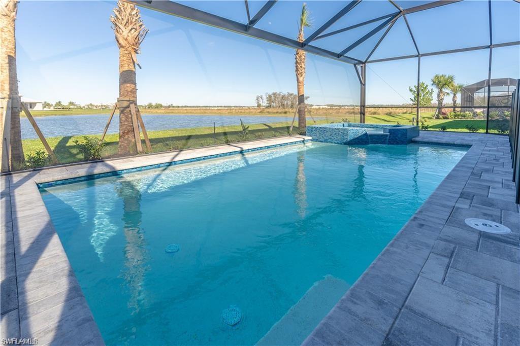 20207 Napa Loop Estero, FL 33928 - Photo 32 of 42 a view of a swimming pool with a patio