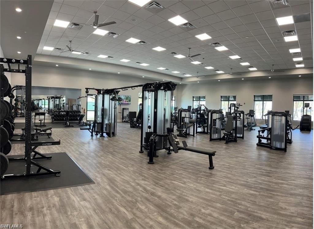 20207 Napa Loop Estero, FL 33928 - Photo 37 of 42 a view of a room with gym equipment and lots of room
