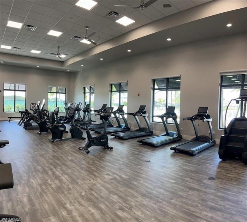 20207 Napa Loop Estero, FL 33928 - Photo 41 of 42 a living room with furniture hard wood floor and a glass door