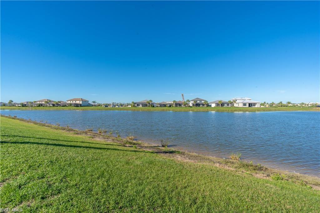 20207 Napa Loop Estero, FL 33928 - Photo 42 of 42 a view of a lake with houses in the back