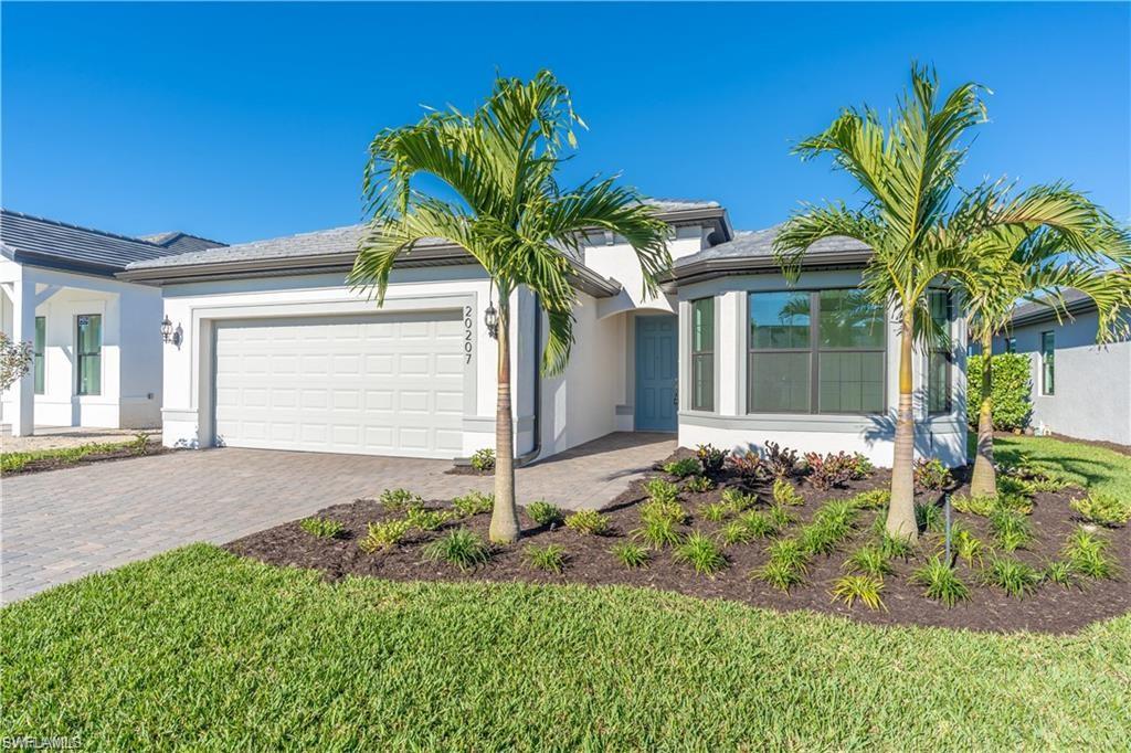 20207 Napa Loop Estero, FL 33928 - Photo 5 of 42 a front view of a house with a yard