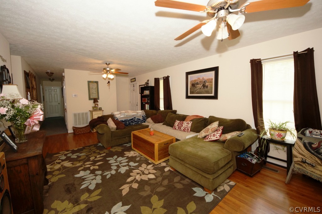 40 Winding Ridge Way Bumpass, VA 23024 - Photo 6 of 16 a living room with furniture and a flat screen tv