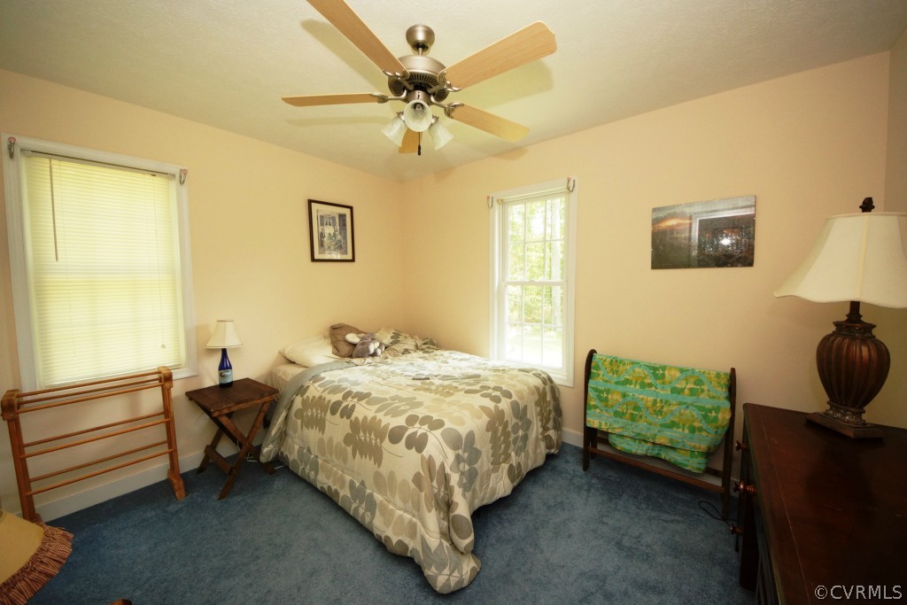 40 Winding Ridge Way Bumpass, VA 23024 - Photo 9 of 16 a bed sitting in a bedroom next to a window