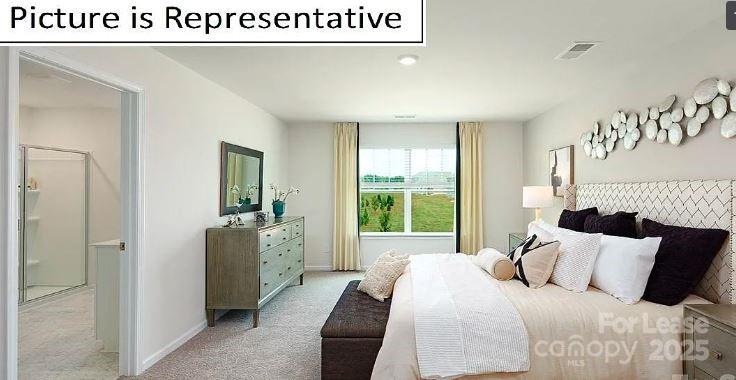 1365 Secrest Cmns Drive Monroe, NC 28112 - Photo 11 of 21 a bedroom with a bed and a large window