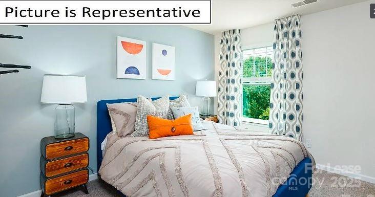 1365 Secrest Cmns Drive Monroe, NC 28112 - Photo 13 of 21 a bedroom with a bed and lamp