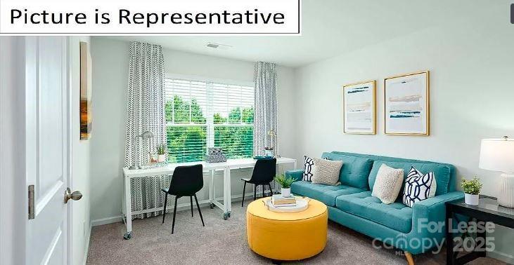 1365 Secrest Cmns Drive Monroe, NC 28112 - Photo 14 of 21 a living room with furniture and a large window