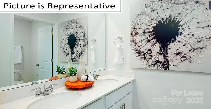 1365 Secrest Cmns Drive Monroe, NC 28112 - Photo 15 of 21 a bathroom with a sink and a mirror