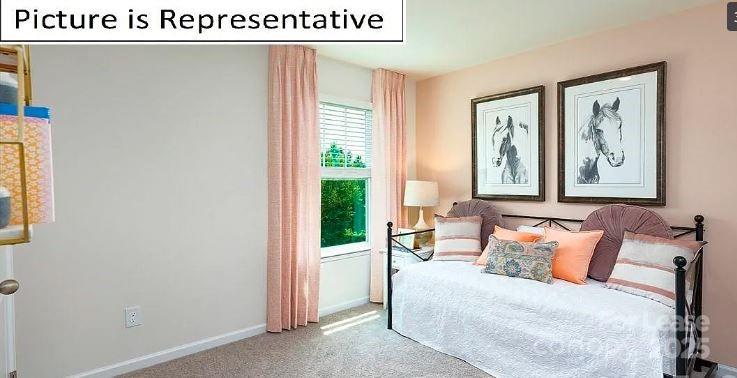 1365 Secrest Cmns Drive Monroe, NC 28112 - Photo 17 of 21 a bedroom with a bed and a painting on the wall