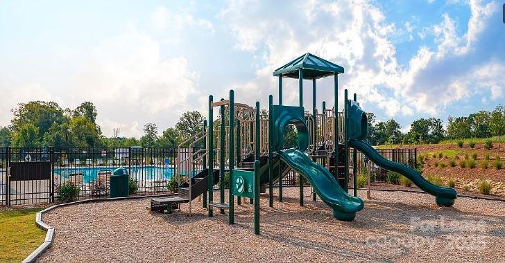 1365 Secrest Cmns Drive Monroe, NC 28112 - Photo 21 of 21 a view of a deck with a table and chairs with wooden floor and fence