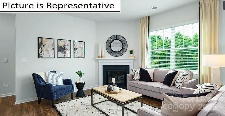 1365 Secrest Cmns Drive Monroe, NC 28112 - Photo 5 of 21 a living room with furniture and a fireplace