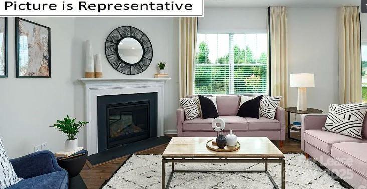 1365 Secrest Cmns Drive Monroe, NC 28112 - Photo 6 of 21 a living room with furniture and a fireplace