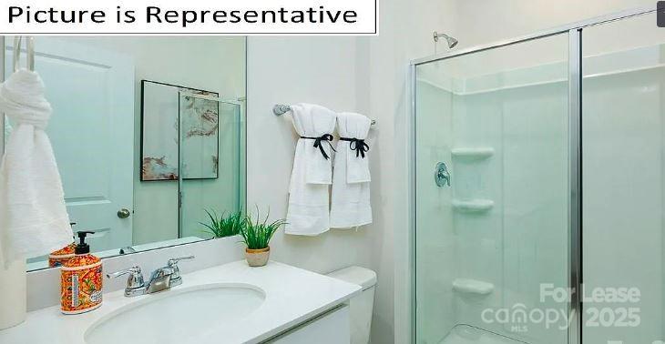 1365 Secrest Cmns Drive Monroe, NC 28112 - Photo 9 of 21 a bathroom with a sink and mirror