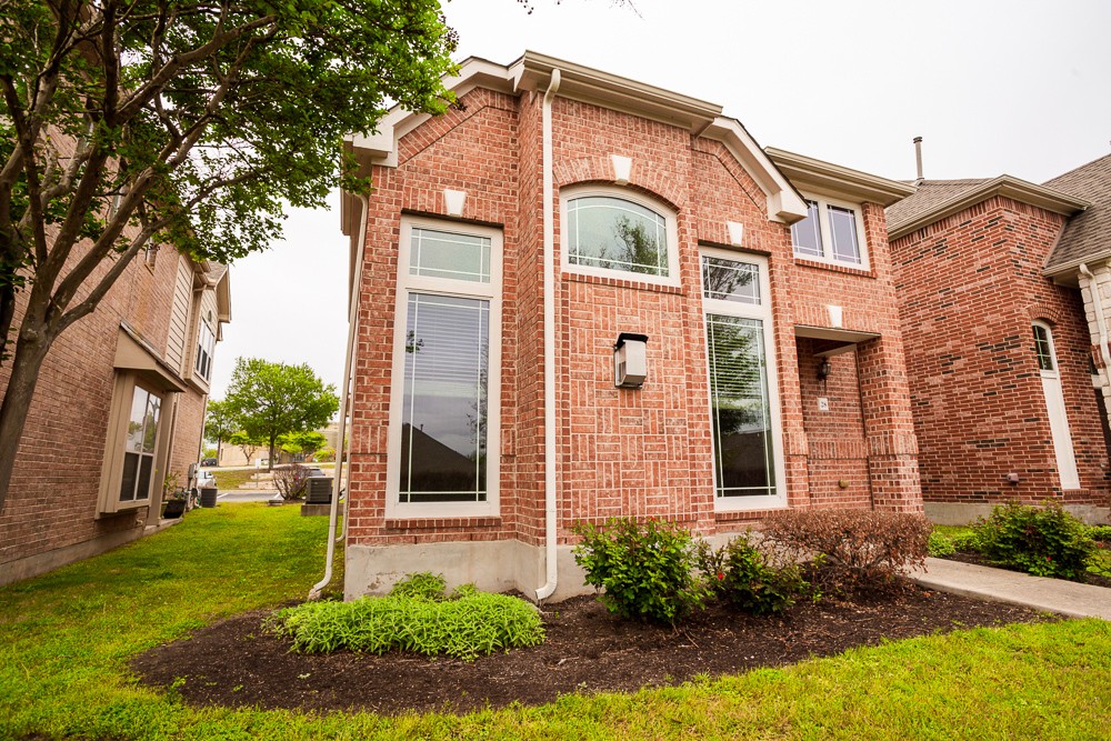 14812 Avery Ranch Boulevard, Unit 28 Austin, TX 78717 - Photo 3 of 21 a front view of a house with garden