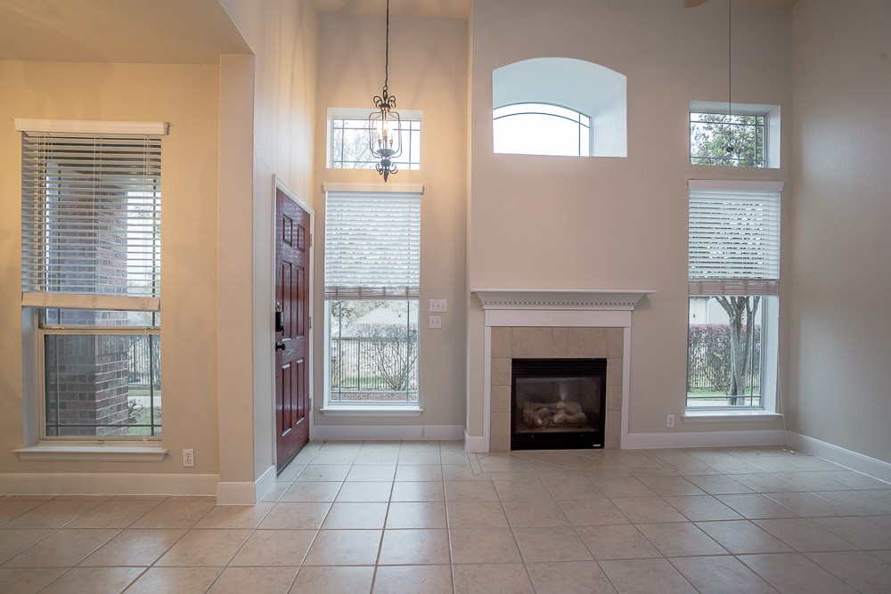 14812 Avery Ranch Boulevard, Unit 28 Austin, TX 78717 - Photo 5 of 21 an empty room with windows and fireplace