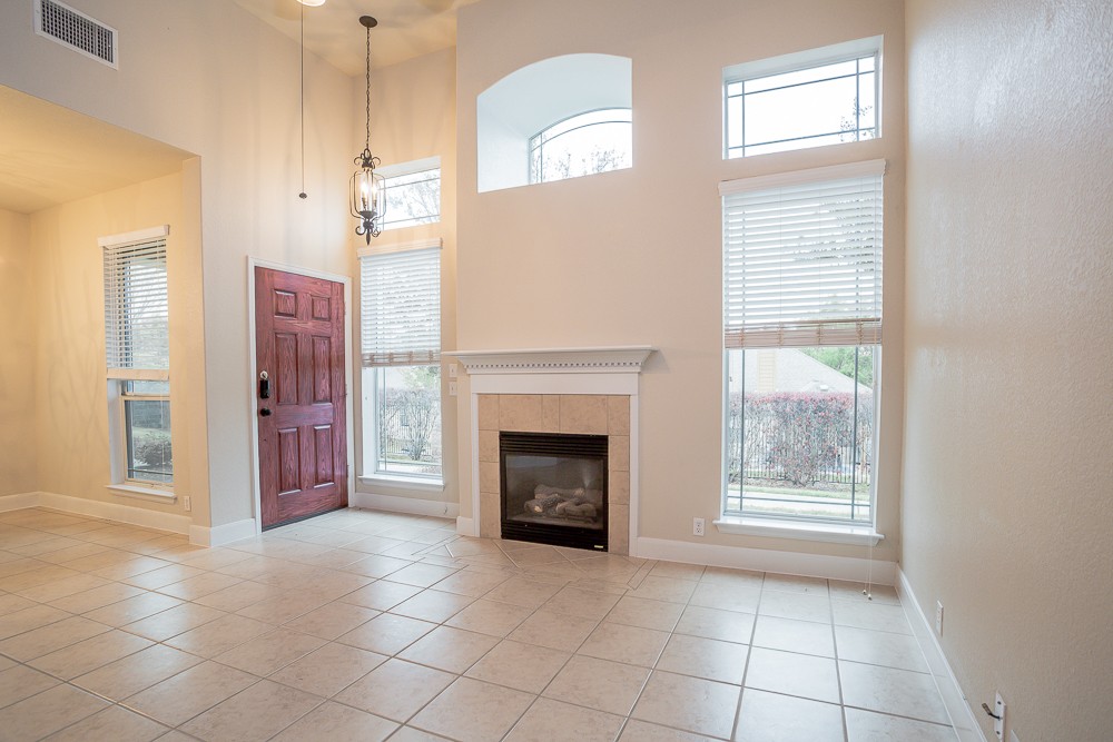 14812 Avery Ranch Boulevard, Unit 28 Austin, TX 78717 - Photo 7 of 21 a view of an empty room with window and fire place