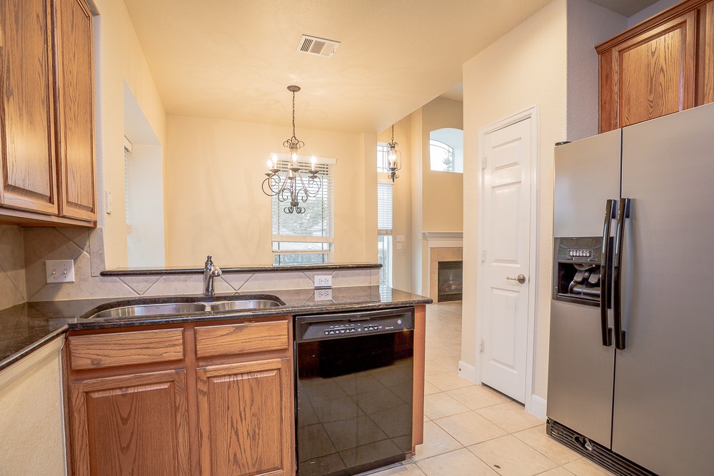 14812 Avery Ranch Boulevard, Unit 28 Austin, TX 78717 - Photo 10 of 21 a kitchen with a sink stove and refrigerator