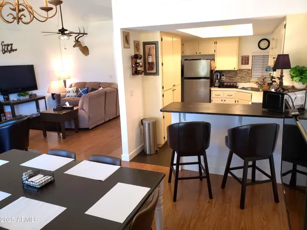 a kitchen with stainless steel appliances a stove a sink and a refrigerator