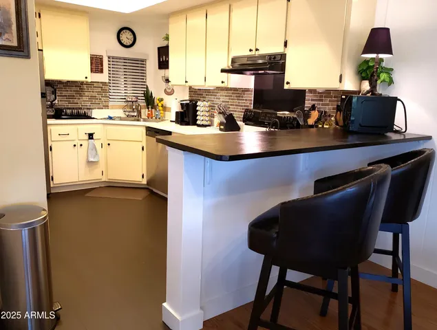 a bedroom with a bed and a lamp