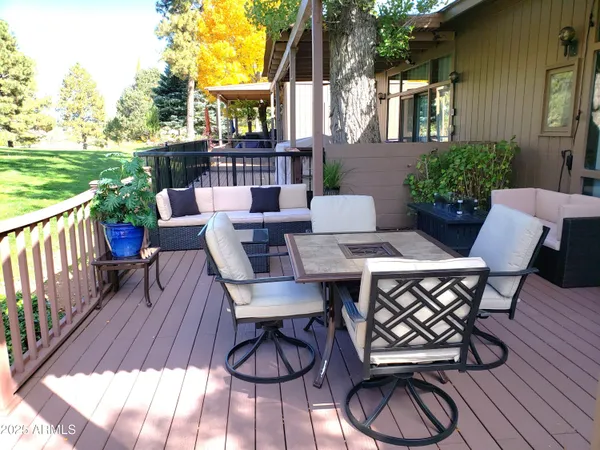 a view of a patio with table and chairs and potted plants