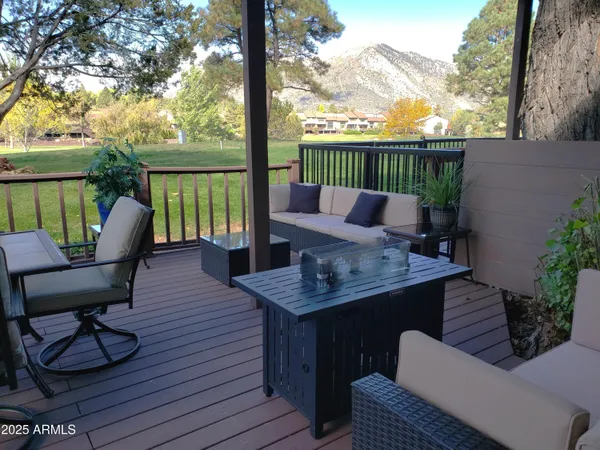 a view of a patio with couple of chairs