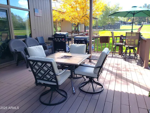 a view of a chairs and tables in a patio