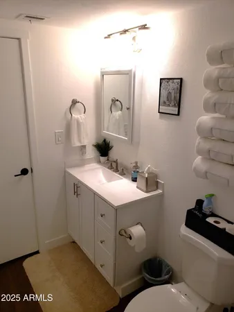 a bedroom with a bed and a mirror
