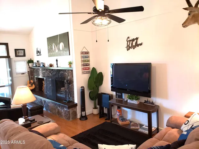 a living room with furniture and a flat screen tv