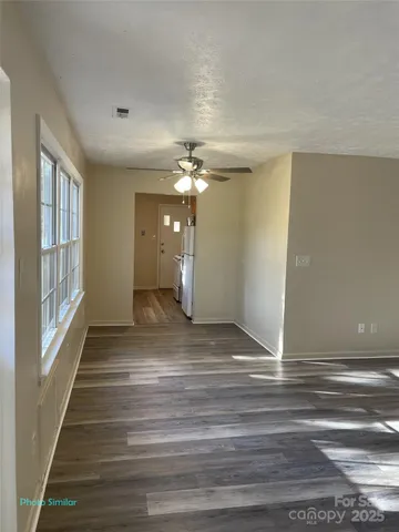 a view of a livingroom with wooden floor