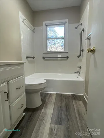 a bathroom with a toilet a sink and a bathtub