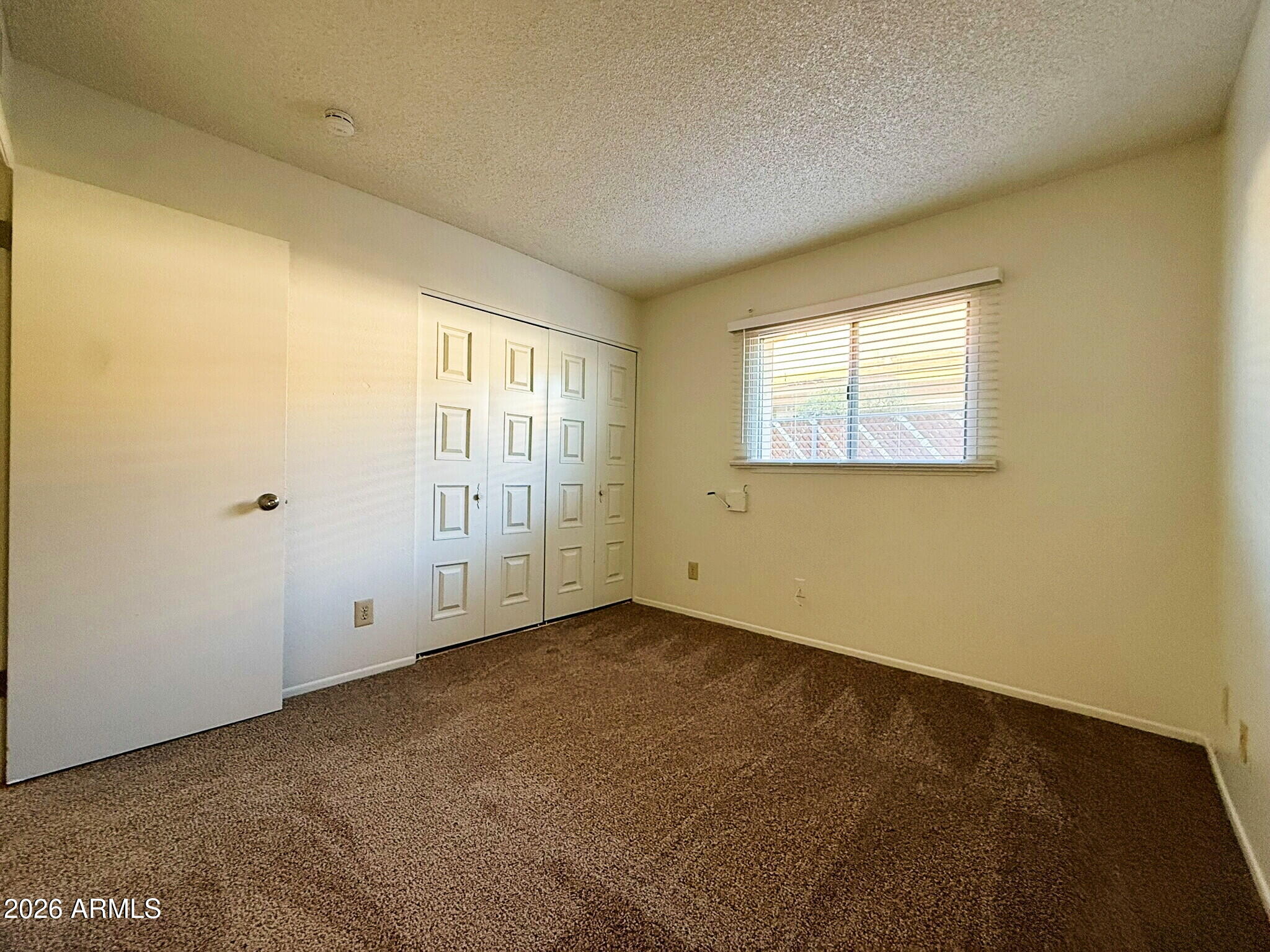 5208 West Calavar Road Glendale, AZ 85306 - Photo 19 of 39 an empty room with windows