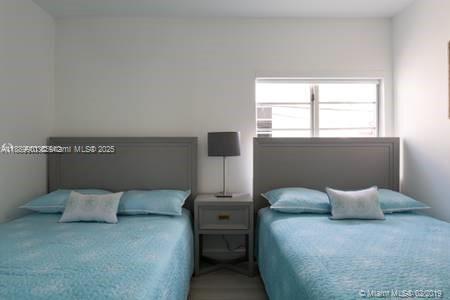 1450 Meridian Avenue, Unit 201 Miami Beach, FL 33139 - Photo 15 of 19 a bedroom with a bed and window