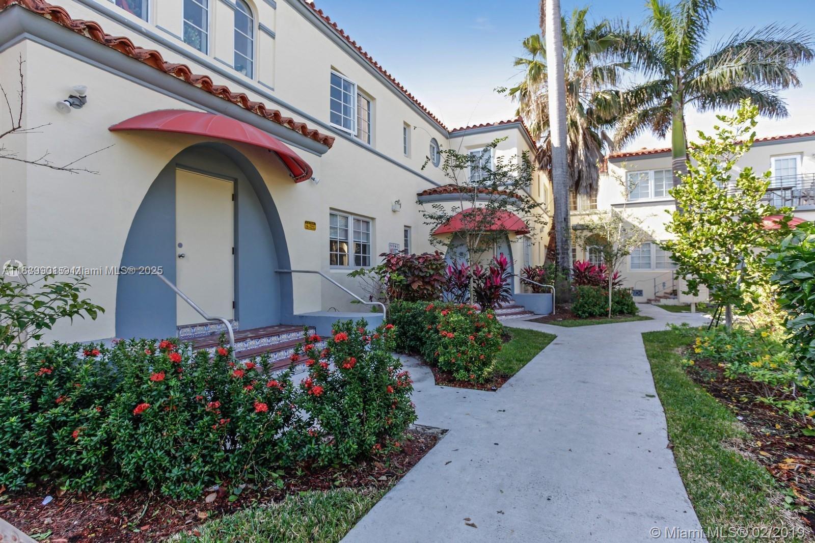 1450 Meridian Avenue, Unit 201 Miami Beach, FL 33139 - Photo 18 of 19 a front view of house with yard and green space