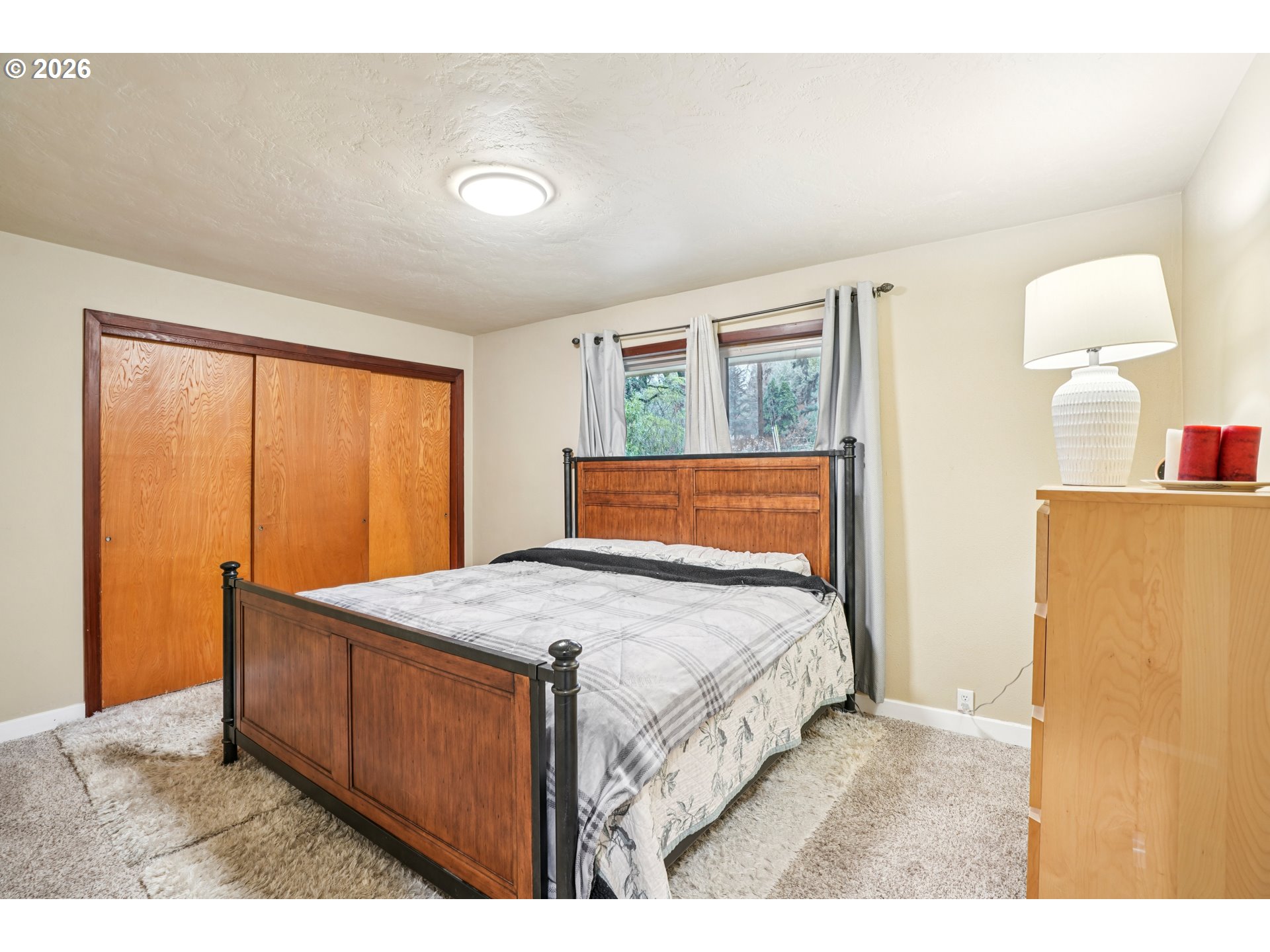 12444 Southwest 57th Avenue Portland, OR 97219 - Photo 11 of 44 a bedroom with a bed and a dresser