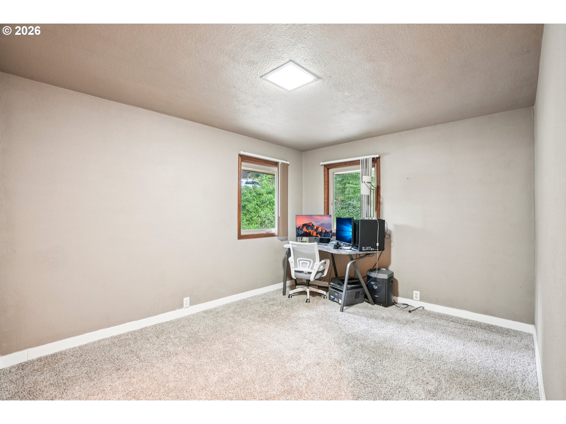 12444 Southwest 57th Avenue Portland, OR 97219 - Photo 14 of 44 a living room with furniture and a window