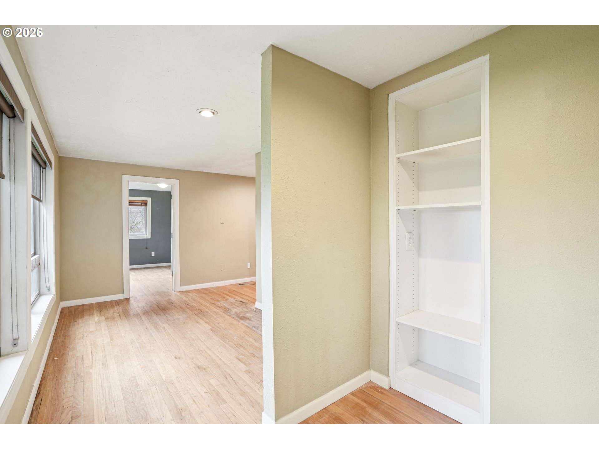 12444 Southwest 57th Avenue Portland, OR 97219 - Photo 18 of 44 a view of an empty room with wooden floor