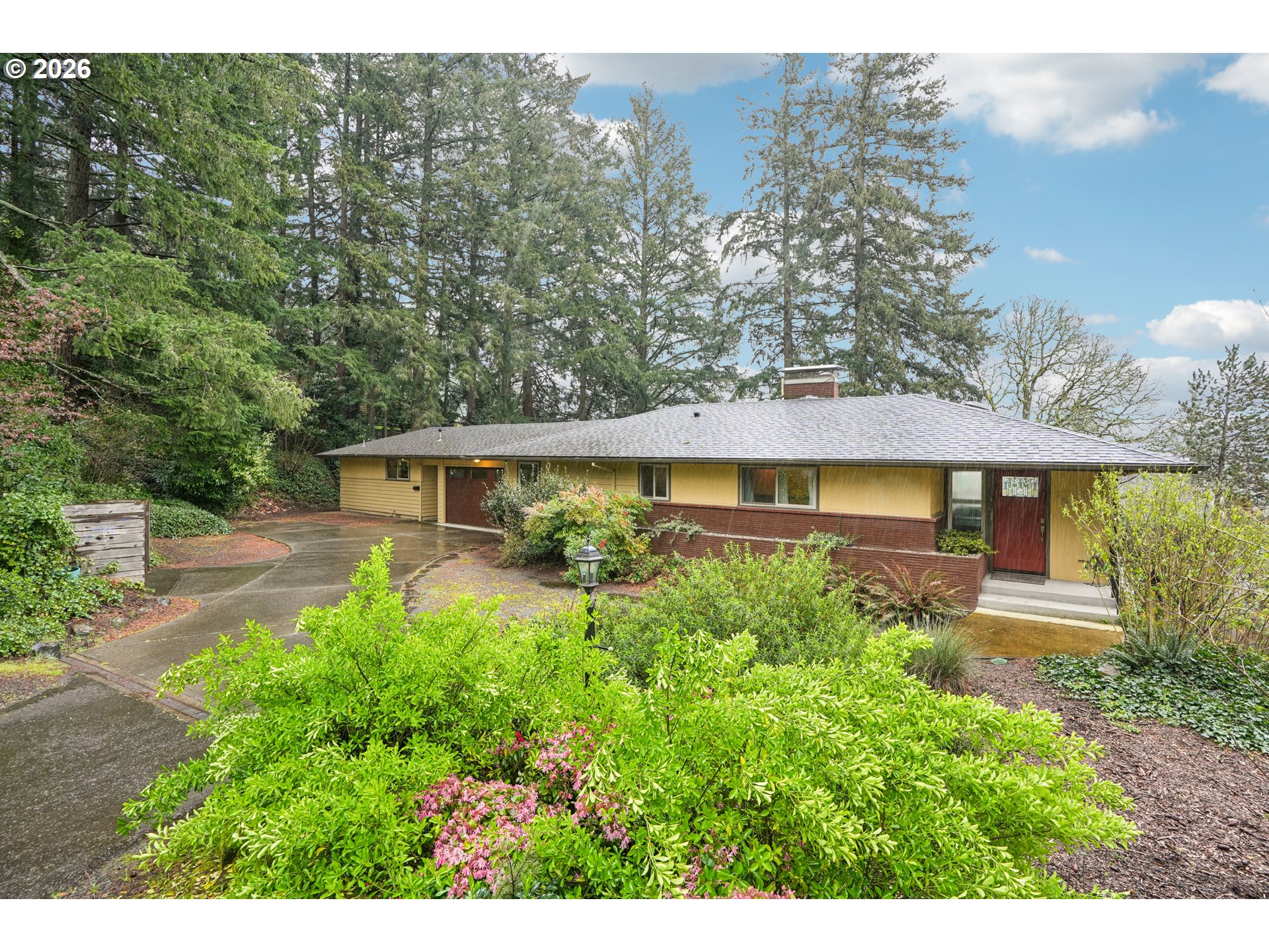 12444 Southwest 57th Avenue Portland, OR 97219 - Photo 2 of 44 a front view of a house with a yard