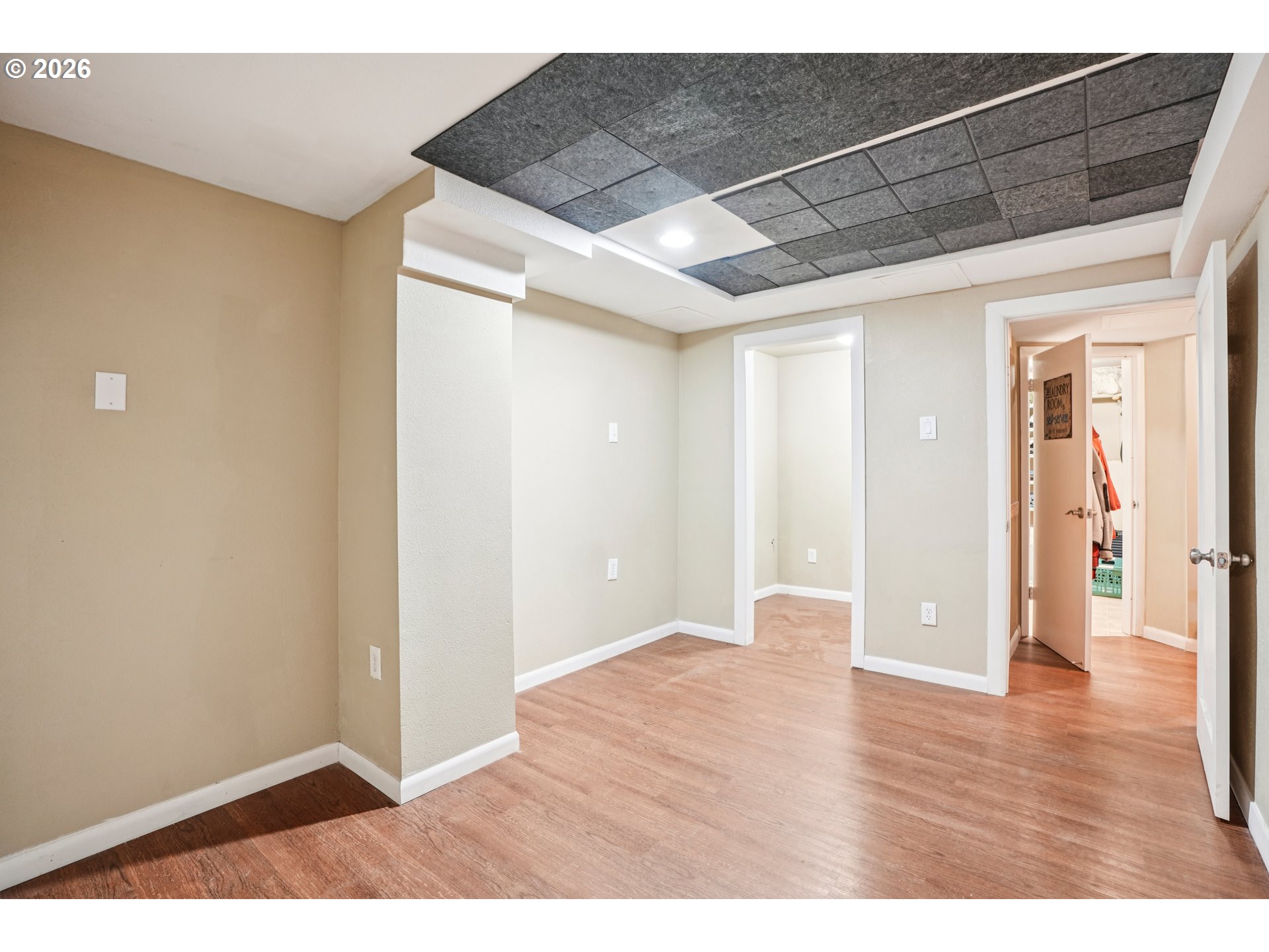 12444 Southwest 57th Avenue Portland, OR 97219 - Photo 21 of 44 a view of an empty room with wooden floor